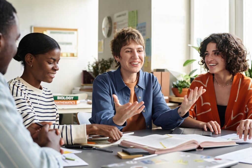 Smiling Teacher Engaging Students in Study Session